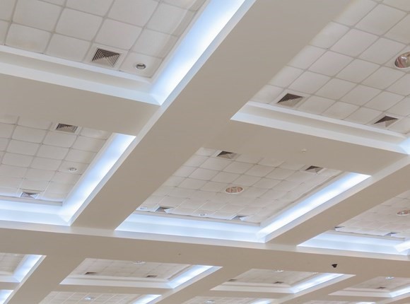 Photo of lights built in to a plasterboard ceiling | Featured image for Plasterboard Ceiling Design Ideas blog.