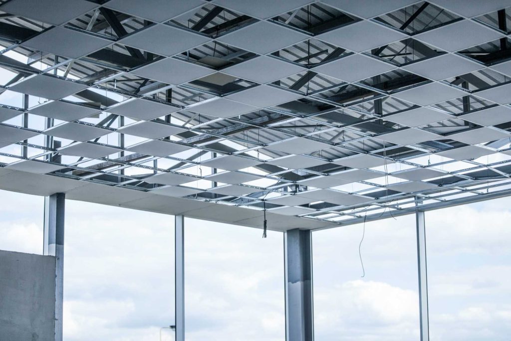 Suspended ceiling under construction | Featured image for the blog What is a Suspended Ceiling? from BetaBoard.