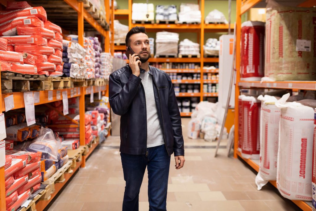 Man in a store seeking to purchase insulation | Featured image for the How to Choose Insulation blog from BetaBoard.