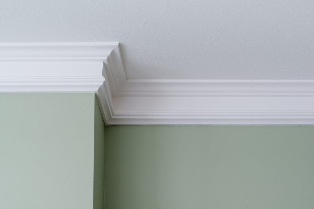 Cornice above green walls | Featured image for the Unique Cornice Decorating Ideas blog from BetaBoard.