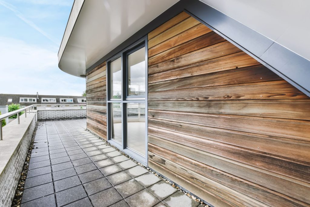 Large Outdoor Balcony After a Rain Shower | Featured image for the Weatherproof Cladding Blog by BetaBoard.