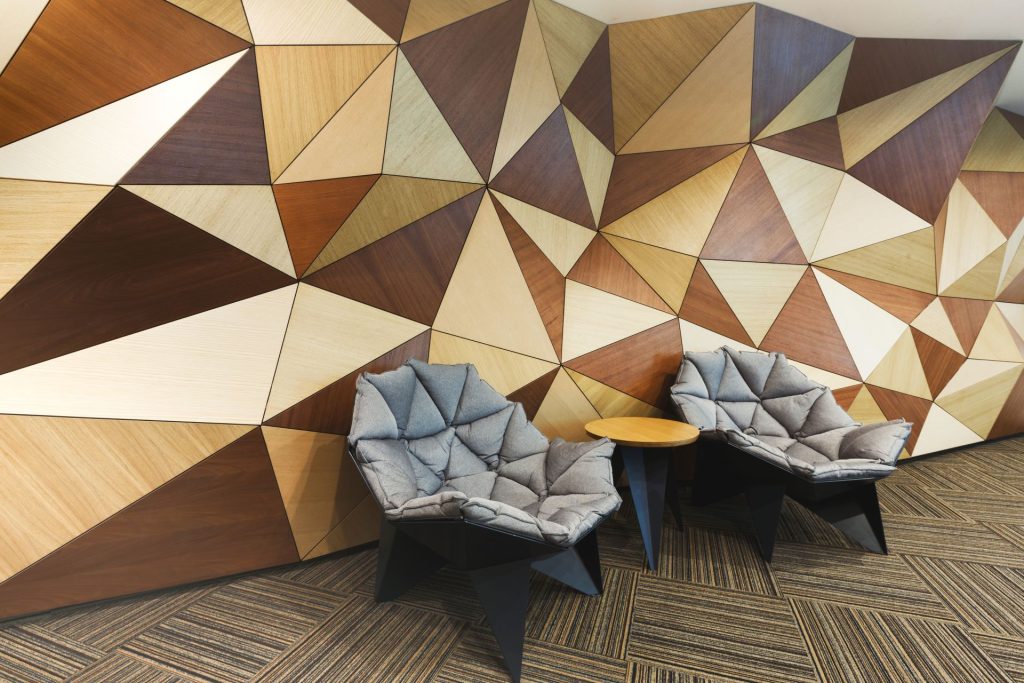 Modern Hotel Lobby with Textured Feature Wall | Featured image for the Decorative Wall Design Blog by BetaBoard.